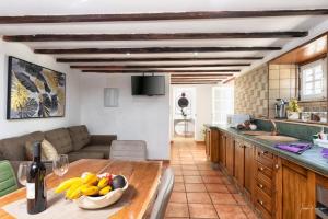 a kitchen with a table with a bowl of fruit on it at LAS VALKIRIAS in El Paso