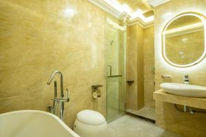 a bathroom with a shower and a sink and a toilet at Ritz Residence @ Imago Loft B 7th Floor in Kota Kinabalu
