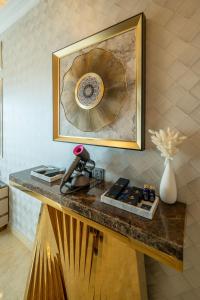 a wooden table with a plate on top of it at Ritz Residence @ Imago Loft B 7th Floor in Kota Kinabalu