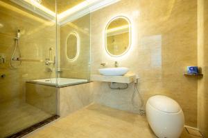 a bathroom with a sink and a shower and a toilet at Ritz Residence @ Imago Loft B 7th Floor in Kota Kinabalu