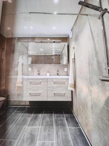 a bathroom with a sink and a mirror at Modern family home in Voss in Vossevangen