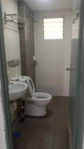 a bathroom with a toilet and a sink at PR1MA Presint 11 Putrajaya in Putrajaya