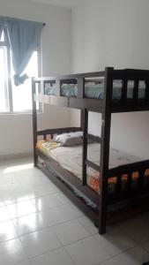 two bunk beds in a room with a window at PR1MA Presint 11 Putrajaya in Putrajaya