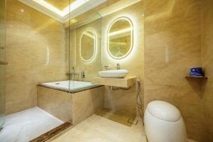 a bathroom with a sink and a mirror at Ritz Residence @ Imago Loft B 7th Floor in Kota Kinabalu