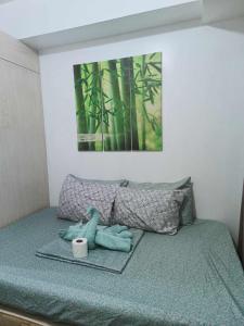 Кровать или кровати в номере Ranj Staycation @ Sea Residences Pasay