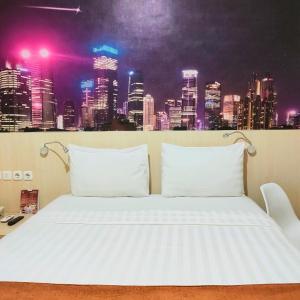Postel nebo postele na pokoji v ubytování D'Bamboo Suites