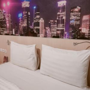 Postel nebo postele na pokoji v ubytování D'Bamboo Suites