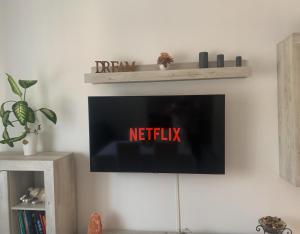 TV a/nebo společenská místnost v ubytování Al Capitello