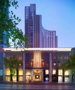 a large building with tall buildings in the background at Grand Hyatt Melbourne in Melbourne