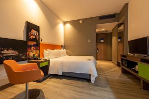 Un televizor și/sau centru de divertisment la Hampton by Hilton Cartagena
