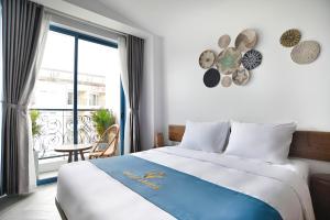 Postel nebo postele na pokoji v ubytování Velar Hotel Con Dao - Vung Tau