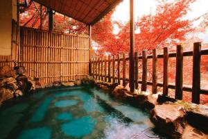 a small pool of water in a fence at FOREST HOUSE NIKKO in Nikko