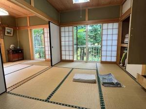 a room with a room with a mattress on the floor at FOREST HOUSE NIKKO in Nikko