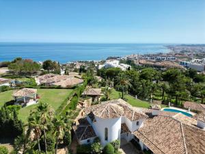 an aerial view of a villa with the ocean in the background at Colina del Mar in Benalmádena