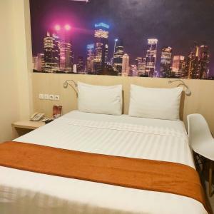 Postel nebo postele na pokoji v ubytování D'Bamboo Suites