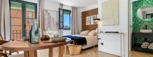 a bedroom with a bed and a table in a room at Casa Pretori in Tarragona +37 photos