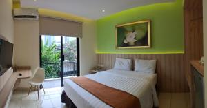 Postel nebo postele na pokoji v ubytování D'Bamboo Suites