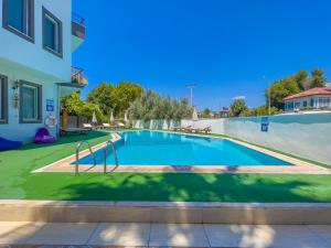 a swimming pool in the backyard of a house at Nehir Apart Hotel in Fethiye