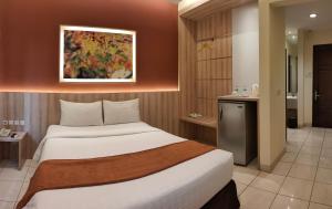 Postel nebo postele na pokoji v ubytování D'Bamboo Suites