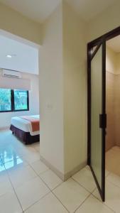 Postel nebo postele na pokoji v ubytování D'Bamboo Suites
