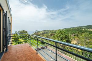 a balcony with a view of the ocean at Vila Sol in Prazeres