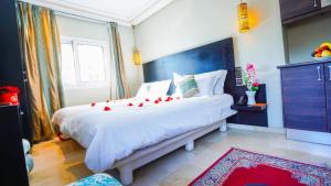 Postel nebo postele na pokoji v ubytování Palais Riad Reda & Spa