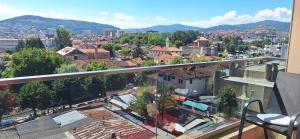 a view of a city from the balcony of a building at Apartman Jaman - Novi Pazar in Novi Pazar