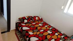 A bed or beds in a room at الحي المحمدي آسفي