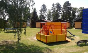 a playground with a play structure in a park at Sportcentrum Dvořák in Hluboká nad Vltavou