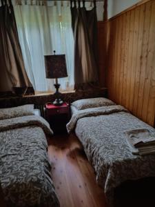 Postel nebo postele na pokoji v ubytování Resort CuraLibera