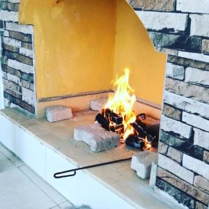a brick oven with a fire in it at Tourist pansiyon 1 in Antalya