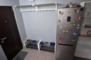 a refrigerator with magnets on it in a room at Locul unde te simți acasă in Câmpulung