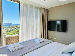 Un pat sau paturi într-o cameră la Moonlight B&B Spa Wellness +18 fotografii