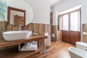 Koupelna v ubytování B&B Dimora Belvedere + 18 fotografií