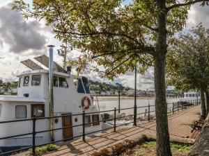 a boat is docked at a dock at Fern in Barnstaple +8 photos
