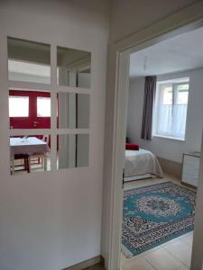 a room with a room with a bed and a mirror at Casa Giuditta in Civezzano