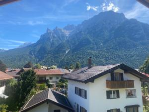 a view of the mountains from a house at Ferienwohnung Ferchensee in Mittenwald