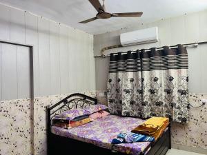 Postel nebo postele na pokoji v ubytování Galaxy Apartment
