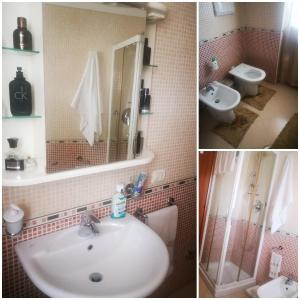 uma casa de banho com um lavatório, um chuveiro e um WC. em B&B Camera per uomini em Pescara