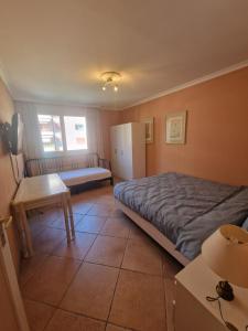 Postel nebo postele na pokoji v ubytování Grand appartement 4-8 personnes