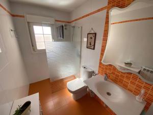 a bathroom with a tub and a toilet and a sink at Casa Rural Goñi in Cabañas de Ebro