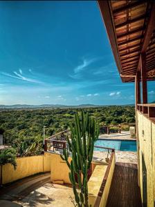a view from a house with a cactus at Pousada Preciosa in Búzios +25 photos