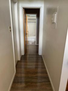 an empty hallway with a hallway leading into a room at Bristlecone Motel in Big Pine