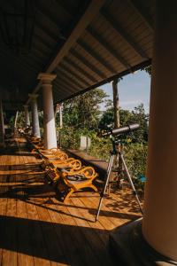 a camera on a wooden deck with a camera at Villa SPACE in Unawatuna