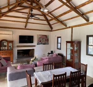 a living room with a couch and a table at Olivos de Terrada in Ciudad Lujan de Cuyo