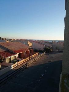 arial view of a building with a parking lot at Studio maison de la mer in Saint Pierre La Mer