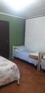 Ein Bett oder Betten in einem Zimmer der Unterkunft Pousada Longe Vista