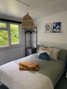 a bedroom with a bed with two pillows on it at Bay view chalet, 28 Sea Valley in Bucks Mills