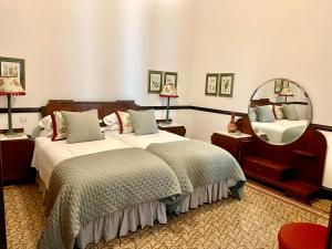 Postel nebo postele na pokoji v ubytování Casa Colonial El Indiano