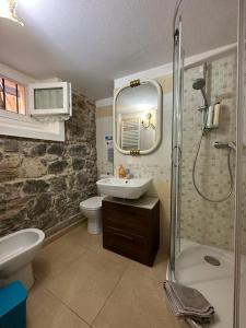a bathroom with a sink toilet and a shower at Taverna abitazione a 15 km da Firenze in Prato